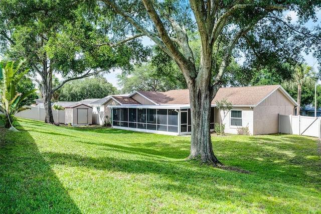 15916 Indian Wells Ct, Clermont, FL 34711 - rear view of house featuring a sunroom and stucco siding