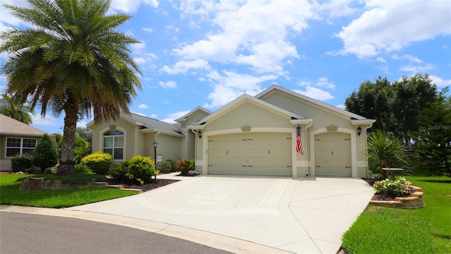 1553 Lynchburg Loop, The Villages, FL 32162 - ranch-style home featuring a garage, stucco siding, driveway, and a front lawn