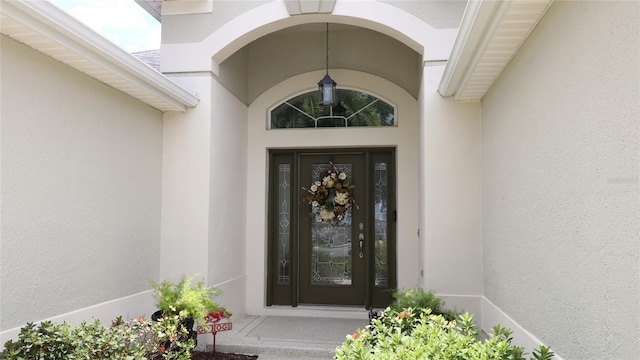 1553 Lynchburg Loop, The Villages, FL 32162 - view of exterior entry featuring stucco siding