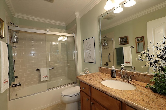 1553 Lynchburg Loop, The Villages, FL 32162 - bathroom featuring vanity, combined bath / shower with glass door, toilet, crown molding, and tile patterned floors