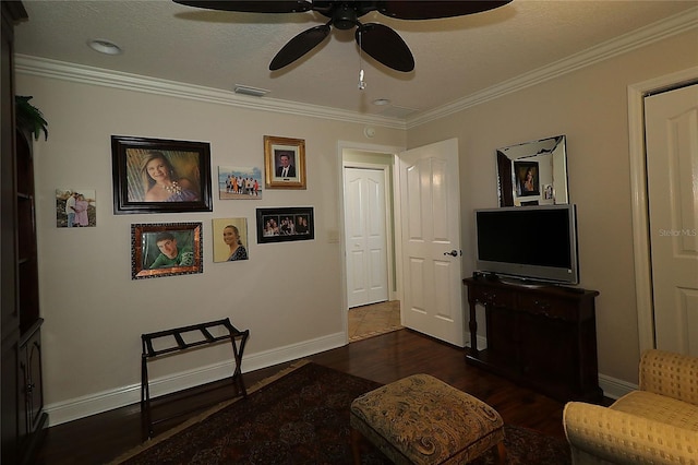 1553 Lynchburg Loop, The Villages, FL 32162 - living area with dark wood-style flooring, a ceiling fan, crown molding, and baseboards