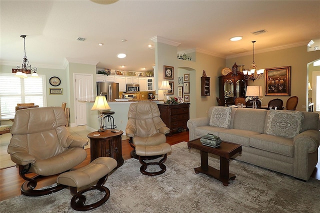 1553 Lynchburg Loop, The Villages, FL 32162 - living area with a chandelier, ornamental molding, arched walkways, light wood-style floors, and recessed lighting