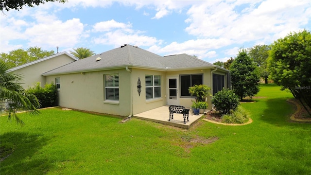 1553 Lynchburg Loop, The Villages, FL 32162 - back of house with a patio, stucco siding, and a lawn