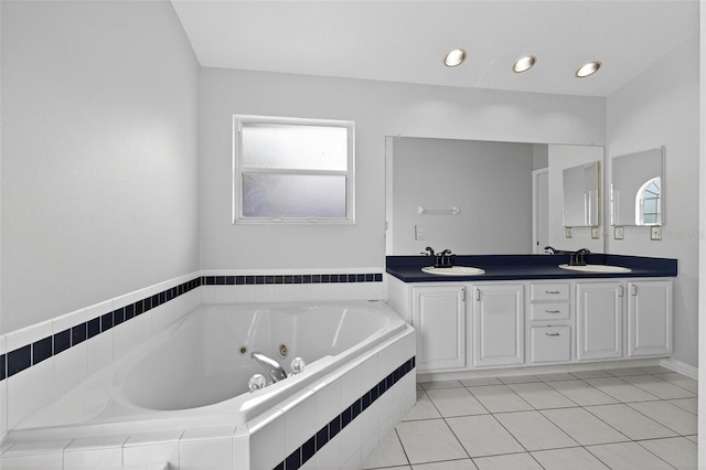 2705 Bayview Dr, Eustis, FL 32726 - bathroom with double vanity, a jetted tub, tile patterned flooring, and recessed lighting