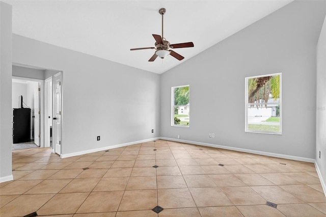 2705 Bayview Dr, Eustis, FL 32726 - spare room featuring ceiling fan, high vaulted ceiling, light tile patterned flooring, and baseboards