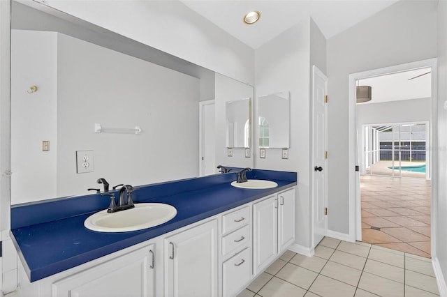 2705 Bayview Dr, Eustis, FL 32726 - full bath with double vanity, tile patterned flooring, and baseboards