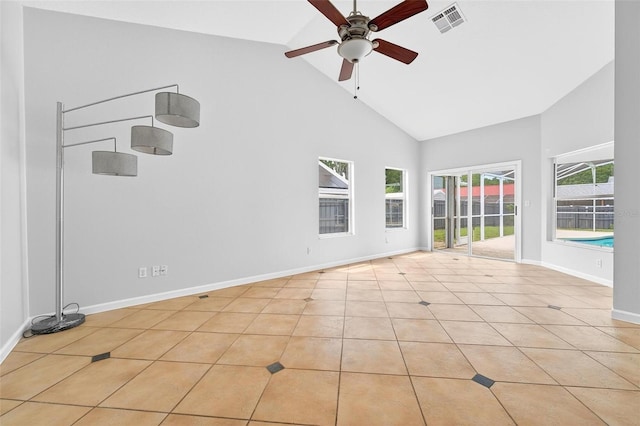 2705 Bayview Dr, Eustis, FL 32726 - spare room with high vaulted ceiling, ceiling fan, light tile patterned flooring, and baseboards