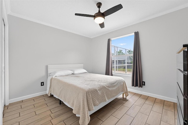 2705 Bayview Dr, Eustis, FL 32726 - bedroom featuring ornamental molding, wood finish floors, baseboards, and ceiling fan