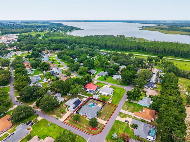 2705 Bayview Dr, Eustis, FL 32726 - aerial view of residential area with a large body of water, property parcel outlined, and a heavily wooded area