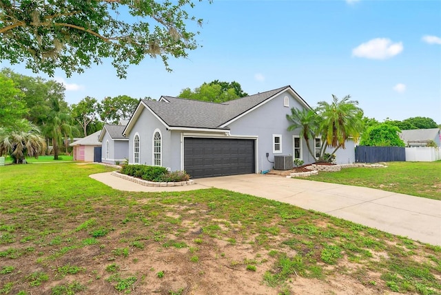 2705 Bayview Dr, Eustis, FL 32726 - single story home with a garage, central air condition unit, concrete driveway, stucco siding, and roof with shingles