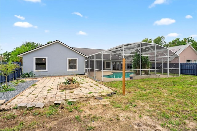 2705 Bayview Dr, Eustis, FL 32726 - rear view of house with a patio area, a lanai, and stucco siding