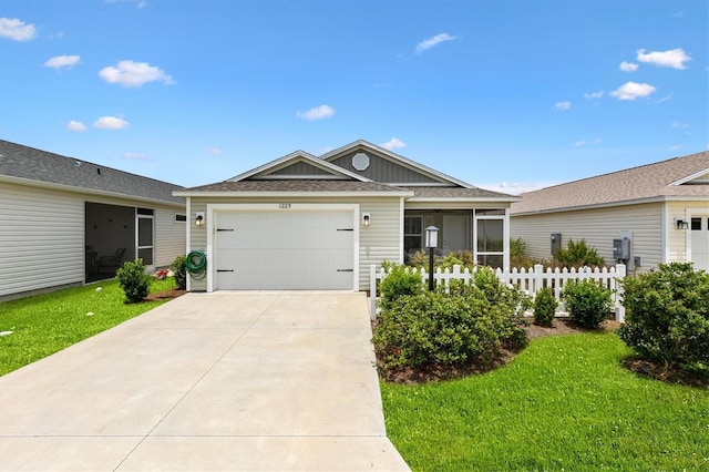 1225 Eunice St, The Villages, FL 34762 - ranch-style house featuring concrete driveway, a garage, roof with shingles, and a sunroom