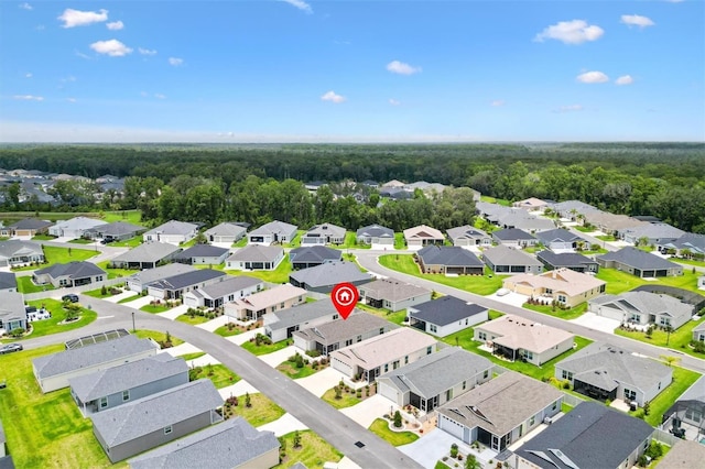 1225 Eunice St, The Villages, FL 34762 - aerial perspective of suburban area with a heavily wooded area