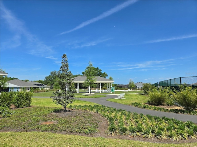 1225 Eunice St, The Villages, FL 34762 - surrounding community featuring a gazebo and a yard