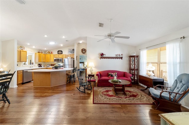 8537 SE 177th Bartram Loop, The Villages, FL 32162 - living area with vaulted ceiling, hardwood / wood-style flooring, ceiling fan, and recessed lighting