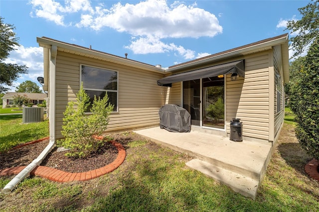 8537 SE 177th Bartram Loop, The Villages, FL 32162 - rear view of property with a patio area and central air condition unit