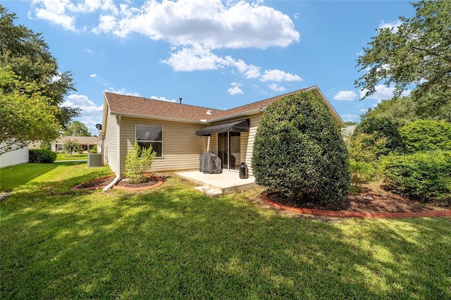 8537 SE 177th Bartram Loop, The Villages, FL 32162 - rear view of property with a patio, a yard, and central air condition unit