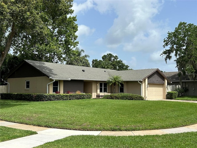 9375 Woodbreeze Blvd, Windermere, FL 34786 - single story home featuring a garage, a front yard, and concrete driveway