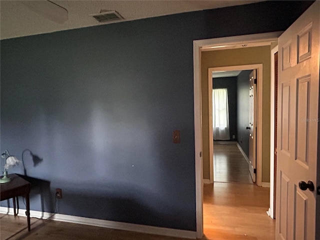 9375 Woodbreeze Blvd, Windermere, FL 34786 - corridor with wood finished floors and baseboards