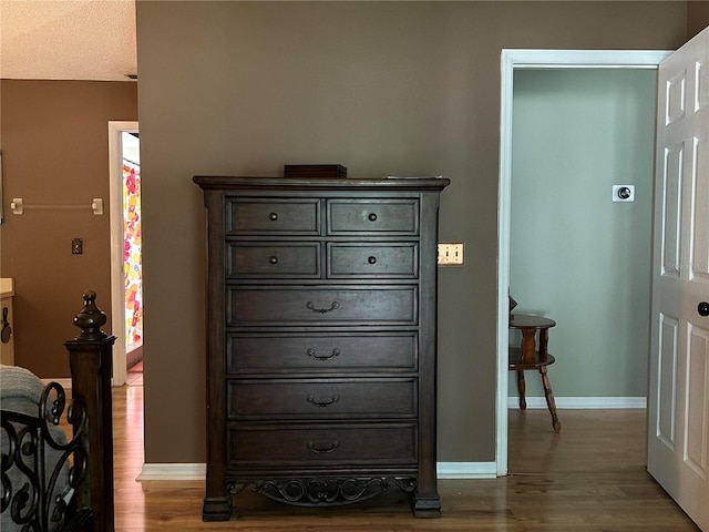 9375 Woodbreeze Blvd, Windermere, FL 34786 - bedroom featuring dark wood finished floors and baseboards