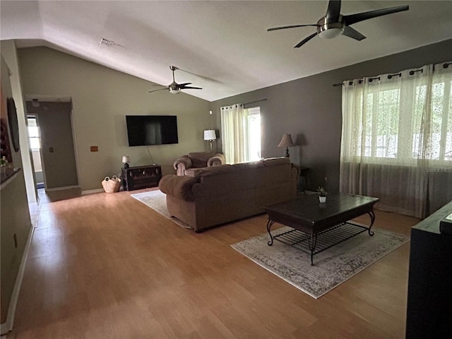 9375 Woodbreeze Blvd, Windermere, FL 34786 - living area featuring ceiling fan, healthy amount of natural light, vaulted ceiling, and wood finished floors