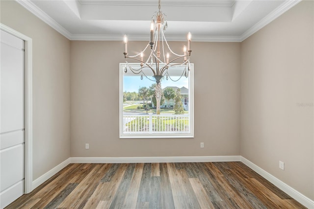 1042 Sugarloaf Key Loop, Lady Lake, FL 32159 - empty room featuring a chandelier, wood finished floors, a raised ceiling, and crown molding