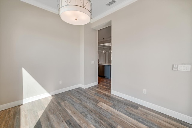 1042 Sugarloaf Key Loop, Lady Lake, FL 32159 - unfurnished room with ornamental molding and wood finished floors