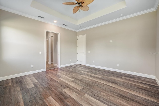 1042 Sugarloaf Key Loop, Lady Lake, FL 32159 - empty room with a raised ceiling, a ceiling fan, wood finished floors, recessed lighting, and crown molding