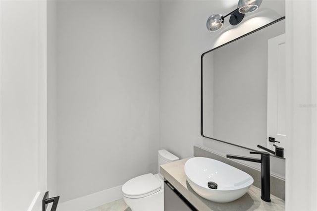 16320 Pendio Dr, Bella Collina, FL 34756 - half bath with vanity, toilet, and baseboards