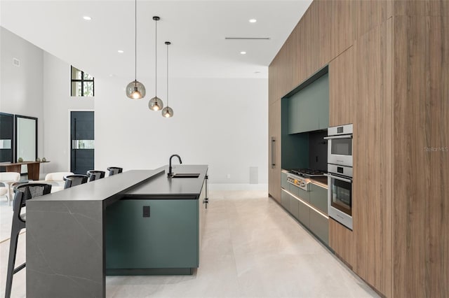 16320 Pendio Dr, Bella Collina, FL 34756 - kitchen with modern cabinets, a sink, recessed lighting, a center island with sink, and stainless steel gas stovetop