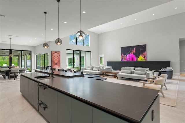16320 Pendio Dr, Bella Collina, FL 34756 - kitchen with a sink, a spacious island, open floor plan, modern cabinets, and dark countertops