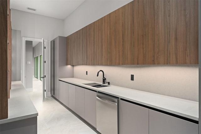 16320 Pendio Dr, Bella Collina, FL 34756 - kitchen with modern cabinets, stainless steel dishwasher, a sink, and light countertops