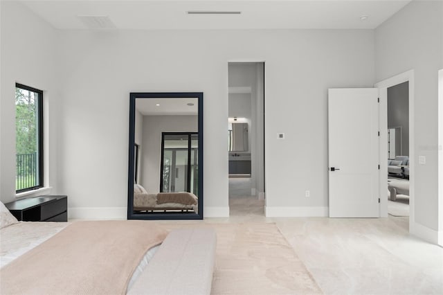 16320 Pendio Dr, Bella Collina, FL 34756 - bedroom featuring baseboards and connected bathroom