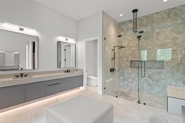 16320 Pendio Dr, Bella Collina, FL 34756 - bathroom with a marble finish shower, double vanity, toilet, and recessed lighting