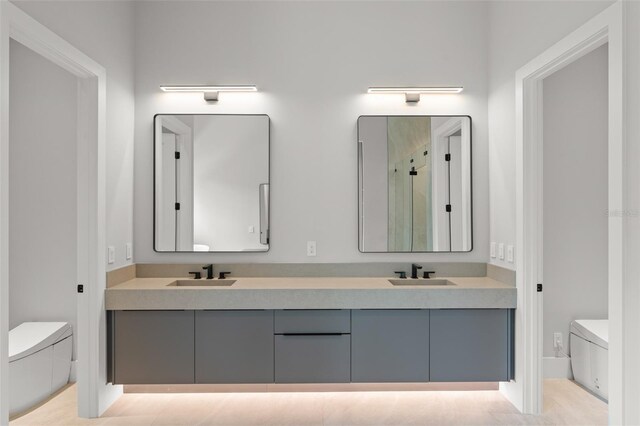 16320 Pendio Dr, Bella Collina, FL 34756 - full bathroom featuring toilet, double vanity, and an enclosed shower
