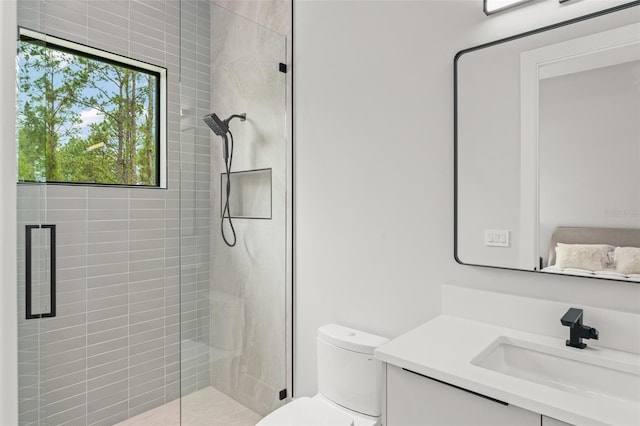 16320 Pendio Dr, Bella Collina, FL 34756 - full bathroom with vanity, a tile shower, and toilet