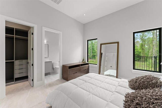 16320 Pendio Dr, Bella Collina, FL 34756 - bedroom featuring a spacious closet, carpet floors, a closet, and ensuite bath