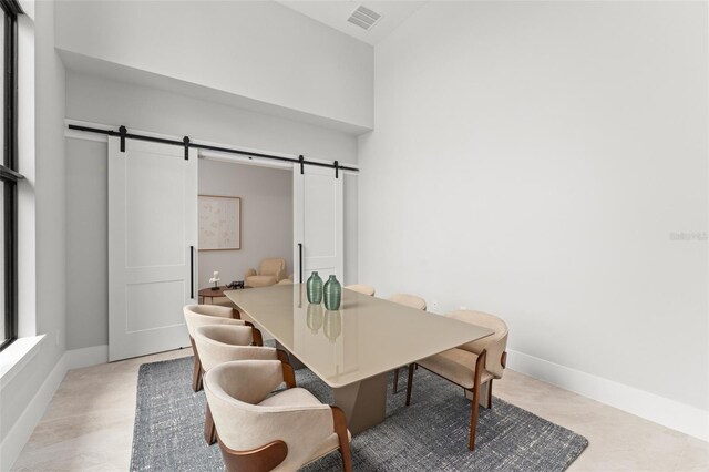 16320 Pendio Dr, Bella Collina, FL 34756 - dining space featuring a barn door and baseboards