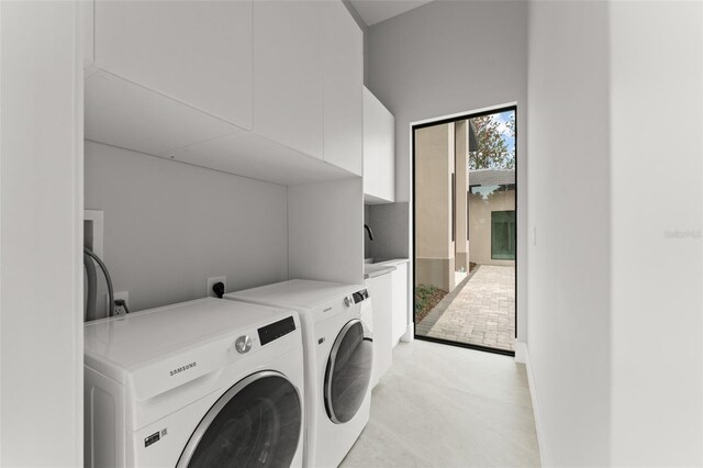 16320 Pendio Dr, Bella Collina, FL 34756 - laundry area with cabinet space and washer and clothes dryer
