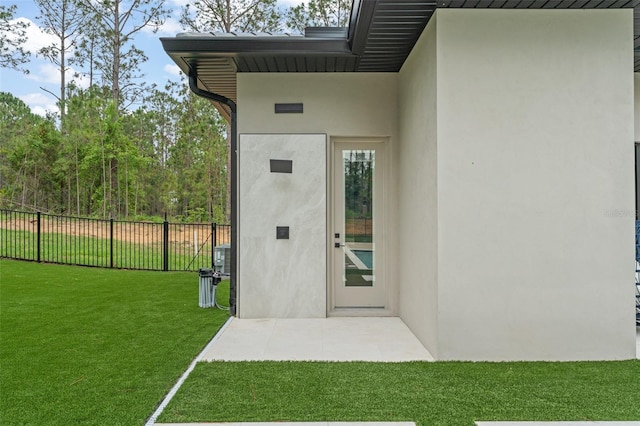 16320 Pendio Dr, Bella Collina, FL 34756 - property entrance with stucco siding and a patio