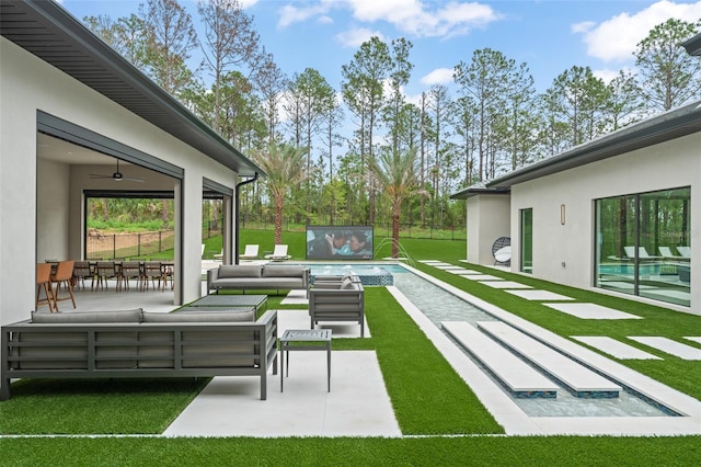 16320 Pendio Dr, Bella Collina, FL 34756 - view of grassy yard featuring outdoor lounge area, an outdoor pool, ceiling fan, and a patio