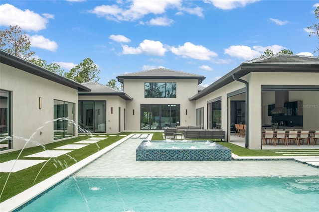 16320 Pendio Dr, Bella Collina, FL 34756 - back of property with an outdoor hangout area, stucco siding, a pool with connected hot tub, and a patio area