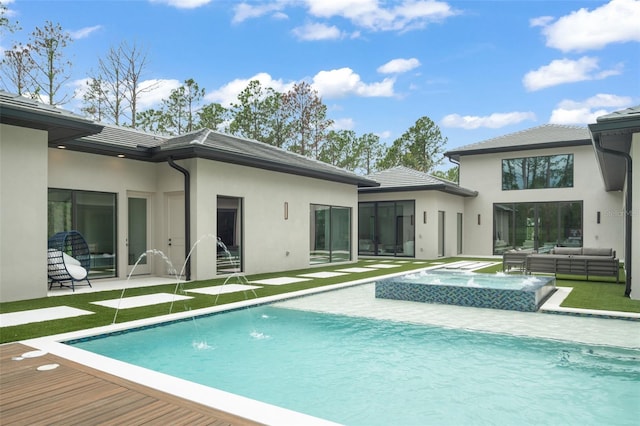 16320 Pendio Dr, Bella Collina, FL 34756 - back of house with an outdoor living space, an in-ground hot tub, stucco siding, and an outdoor pool