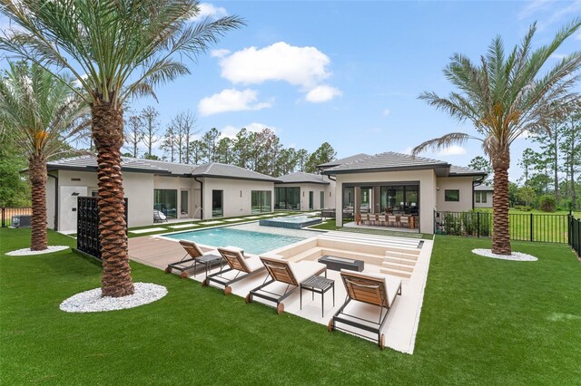 16320 Pendio Dr, Bella Collina, FL 34756 - rear view of property featuring stucco siding, a patio area, and central air condition unit
