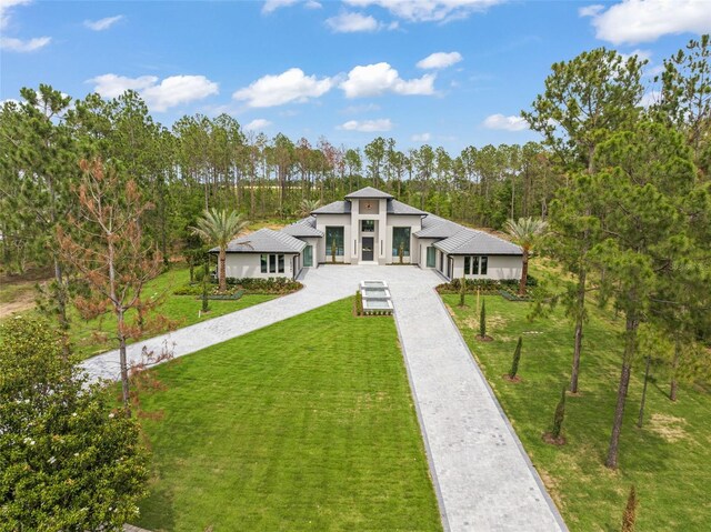 16320 Pendio Dr, Bella Collina, FL 34756 - view of front of property with stucco siding, driveway, and a front yard