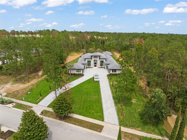 16320 Pendio Dr, Bella Collina, FL 34756 - view of subject property featuring a forest