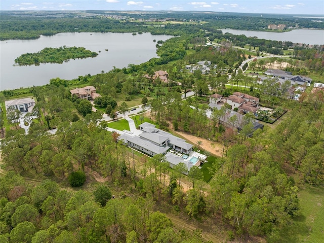 16320 Pendio Dr, Bella Collina, FL 34756 - view of property location with a nearby body of water, nearby suburban area, and a heavily wooded area