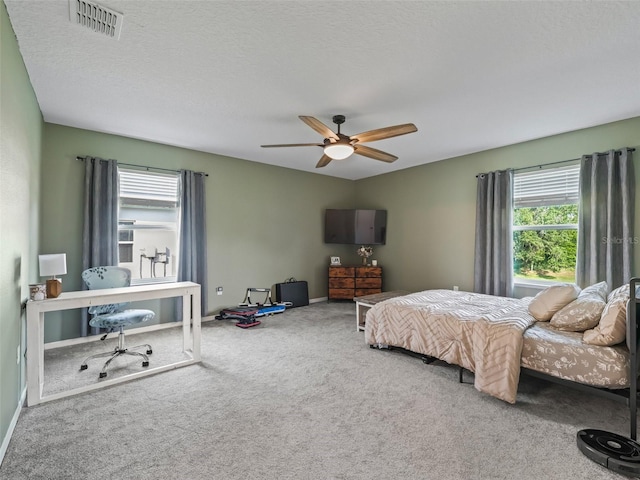 1824 Forest Glen Dr, Fruitland Park, FL 34731 - bedroom with multiple windows, carpet flooring, an office area, and a ceiling fan
