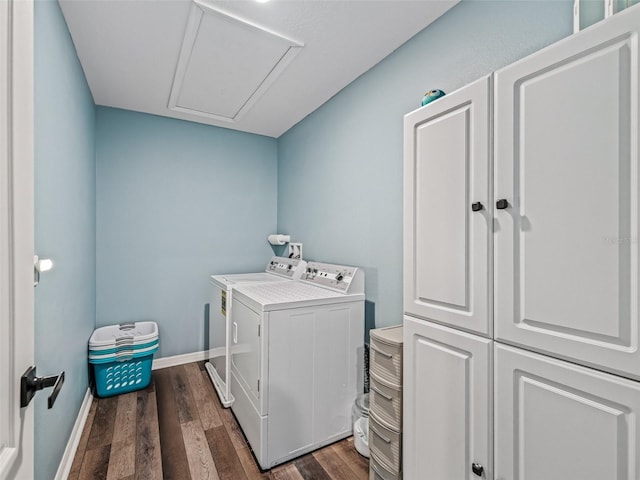 1824 Forest Glen Dr, Fruitland Park, FL 34731 - laundry room featuring washing machine and dryer, cabinet space, dark wood-type flooring, and baseboards