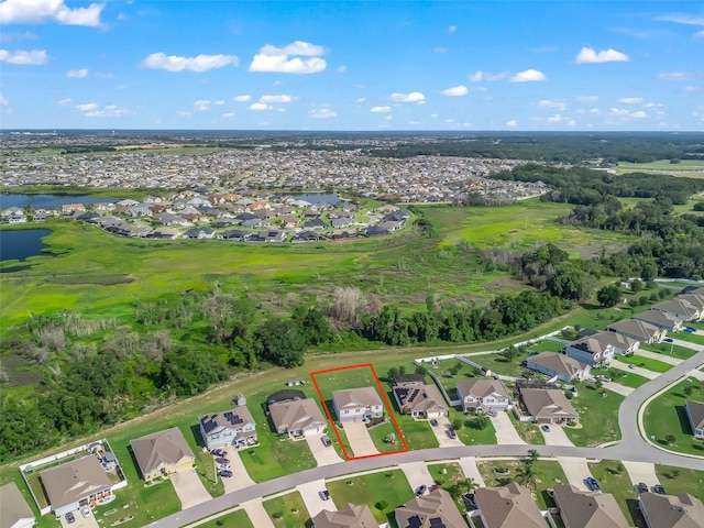 1824 Forest Glen Dr, Fruitland Park, FL 34731 - aerial overview of property's location featuring nearby suburban area, property parcel outlined, and a large body of water